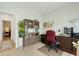 Spacious home office featuring a wooden desk, shelves, and views to other rooms at 5314 Abbey Park Loop, Myrtle Beach, SC 29579