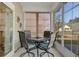 Screened patio with a table and chairs and view of the backyard at 5314 Abbey Park Loop, Myrtle Beach, SC 29579