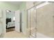 Modern glass shower in a bathroom with tiled walls and view to a bedroom at 5314 Abbey Park Loop, Myrtle Beach, SC 29579