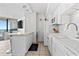 White kitchen with modern appliances and breakfast bar at 5523 North Ocean Blvd. # 1402, Myrtle Beach, SC 29577