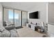 Living room with sofa, ocean view, and balcony access at 5523 North Ocean Blvd. # 1402, Myrtle Beach, SC 29577