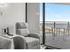 Living room with recliner, balcony access, and ocean view at 5523 North Ocean Blvd. # 1402, Myrtle Beach, SC 29577