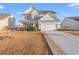 Two-story house with attached garage and landscaping at 556 Majorca Loop, Myrtle Beach, SC 29579