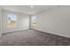 Inviting bedroom featuring plush carpet, natural lighting from two windows, and neutral wall color at 57 Cape Point Dr., Conway, SC 29527