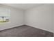 This bedroom features plush gray carpeting and neutral walls at 57 Cape Point Dr., Conway, SC 29527