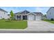 Charming single-story home showcasing a well-manicured lawn and a two-car garage at 57 Cape Point Dr., Conway, SC 29527