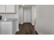 Hallway with luxury vinyl plank flooring and white doors at 57 Cape Point Dr., Conway, SC 29527
