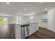 Kitchen island with stainless steel dishwasher, granite countertops, and faucet with a view to the dining area at 57 Cape Point Dr., Conway, SC 29527