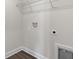 Functional laundry room with convenient hookups, ample wall space, and a wire storage shelf at 57 Cape Point Dr., Conway, SC 29527