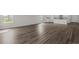 Spacious living room showcases modern wood-look floors and plentiful light with an open concept at 57 Cape Point Dr., Conway, SC 29527