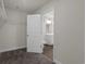 Large walk-in closet with ample shelving and storage space, conveniently located near the bathroom at 57 Cape Point Dr., Conway, SC 29527