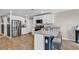 Well-lit kitchen features stainless steel appliances, white cabinetry, and a breakfast bar at 589 Talisman Trail, Longs, SC 29568