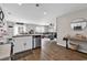 Modern kitchen with stainless steel appliances and open layout flows into the comfy living room at 589 Talisman Trail, Longs, SC 29568