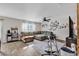 Comfortable living room features a large sectional sofa, ceiling fan, and a gallery wall with photos at 589 Talisman Trail, Longs, SC 29568