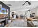 Open-concept living area with a large sectional sofa and direct access to the kitchen and dining area at 589 Talisman Trail, Longs, SC 29568