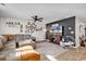 Relaxing living space with a sectional couch, ceiling fan, and Gathering photos displayed on the wall at 589 Talisman Trail, Longs, SC 29568