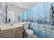 Bathroom with nautical shower curtain, wood vanity, and mirror at 611 S 13Th Ave. # 175, Surfside Beach, SC 29575