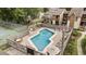 Community pool with surrounding lounge chairs and patio at 611 S 13Th Ave. # 175, Surfside Beach, SC 29575
