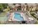 Community pool with surrounding lounge chairs and patio at 611 S 13Th Ave. # 175, Surfside Beach, SC 29575
