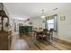 Open concept dining area with a wooden table and kitchen access at 611 S 13Th Ave. # 175, Surfside Beach, SC 29575