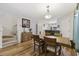 Bright dining area with a wooden table and chairs, adjacent to the kitchen at 611 S 13Th Ave. # 175, Surfside Beach, SC 29575