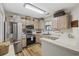 Well-equipped kitchen with stainless steel appliances and light wood cabinets at 611 S 13Th Ave. # 175, Surfside Beach, SC 29575
