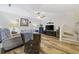 Living room featuring a comfortable couch, wicker chair, and flat-screen TV at 611 S 13Th Ave. # 175, Surfside Beach, SC 29575