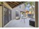 Cozy patio with a table and storage, adjacent to sliding glass doors at 611 S 13Th Ave. # 175, Surfside Beach, SC 29575