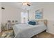 Bright bedroom with a queen bed, ceiling fan, and ample natural light at 636 Pistoia Ln., Myrtle Beach, SC 29579