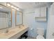 Double vanity bathroom with light blue walls and beige countertops at 7000 N Ocean Blvd. # 326, Myrtle Beach, SC 29572