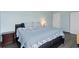 Comfortable bedroom with king-size bed and en-suite bath at 7000 N Ocean Blvd. # 326, Myrtle Beach, SC 29572