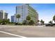 Oceanfront building with parking and palm trees at 7000 N Ocean Blvd. # 326, Myrtle Beach, SC 29572