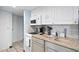 Small condo kitchen with granite countertops and white cabinets at 7000 N Ocean Blvd. # 326, Myrtle Beach, SC 29572