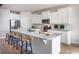 Modern kitchen with white cabinets, granite countertops and island at 711 Isle Verde Dr, Myrtle Beach, SC 29579