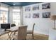 Bright office space with large windows and a rustic wooden desk at 711 Isle Verde Dr, Myrtle Beach, SC 29579