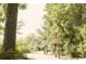 People bike down tree-lined path at 718 Isle Verde Dr, Myrtle Beach, SC 29579