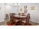 Formal dining room with a large wooden table, six chairs, and a china cabinet at 719 Treaty Ct., Myrtle Beach, SC 29588