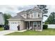 Two-story house with brick and siding exterior, a large yard, and a two-car garage at 788 Rambler Ct., Myrtle Beach, SC 29588