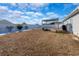 Spacious backyard with a white fence, pergola, and a grill, perfect for outdoor gatherings and relaxation at 801 Benchmade Rd., Conway, SC 29527