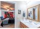 Bathroom featuring a sink, a gold-framed mirror, and a view into a bedroom at 801 Benchmade Rd., Conway, SC 29527
