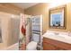 Bathroom features a shower and tub, storage cabinet above the toilet, and a vanity sink at 801 Benchmade Rd., Conway, SC 29527