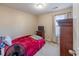 Bedroom view shows a single bed, window with blinds, dresser and TV, and neutral carpet at 801 Benchmade Rd., Conway, SC 29527