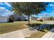 Well-maintained front lawn with a mature tree providing shade and curb appeal to this charming home at 801 Benchmade Rd., Conway, SC 29527