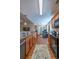 Kitchen showcasing stainless steel appliances, wood cabinets, granite countertops, and hardwood floors at 801 Benchmade Rd., Conway, SC 29527