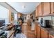Kitchen and office area boasting wood floors, cabinetry, granite countertops, and stainless steel appliances at 801 Benchmade Rd., Conway, SC 29527
