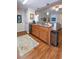 Kitchen showcasing stainless steel appliances, wood cabinets, granite countertops, and hardwood floors at 801 Benchmade Rd., Conway, SC 29527