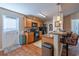 Open kitchen with stainless steel appliances, wood cabinets, hardwood floors, and breakfast bar seating at 801 Benchmade Rd., Conway, SC 29527