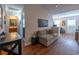 Open living area with stylish wood floors and comfortable seating, showcasing a welcoming ambiance at 801 Benchmade Rd., Conway, SC 29527