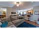 Cozy living room with plush sofa, open to the kitchen, creating a comfortable and inviting living space at 801 Benchmade Rd., Conway, SC 29527