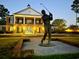 Elegant clubhouse with a golfer statue at entrance at 886 Foxtail Dr. # C-39, Longs, SC 29568